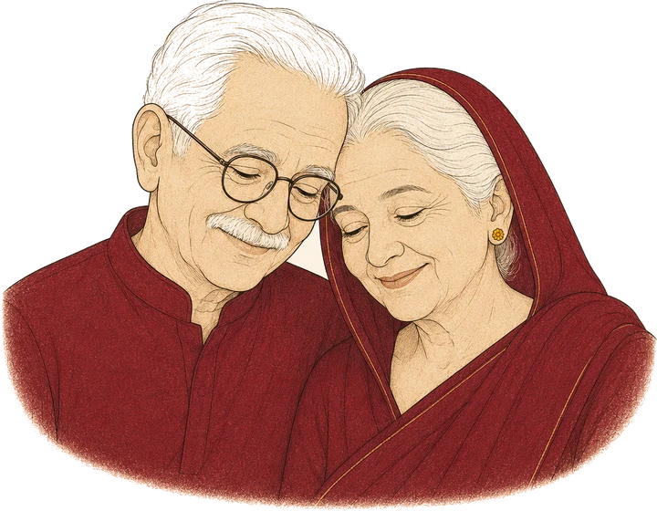 A grandfather in round spectacles and a grandmother in a maroon pallu, smiling together